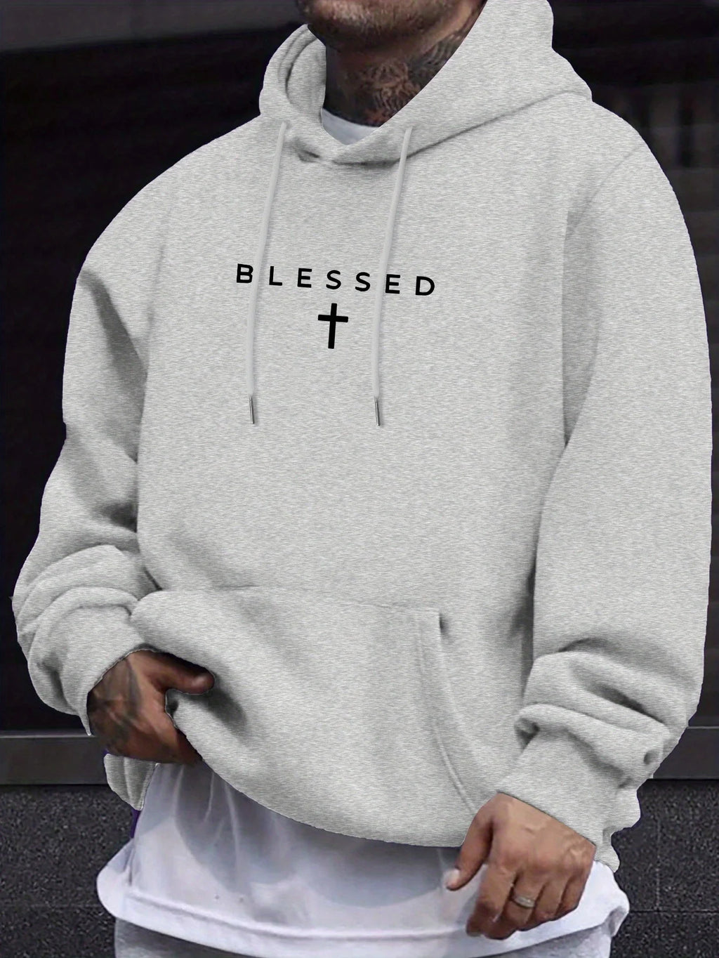 A men's casual hooded sweater with blessing cross design and geometric patterns in a regular fit suitable for spring and autumn
